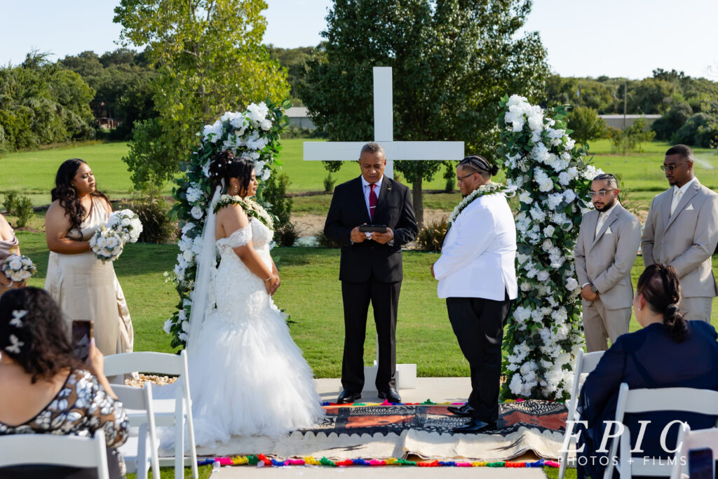 bride and groom at chateau joli venue, near fort worth texas, having a polynesian wedding 