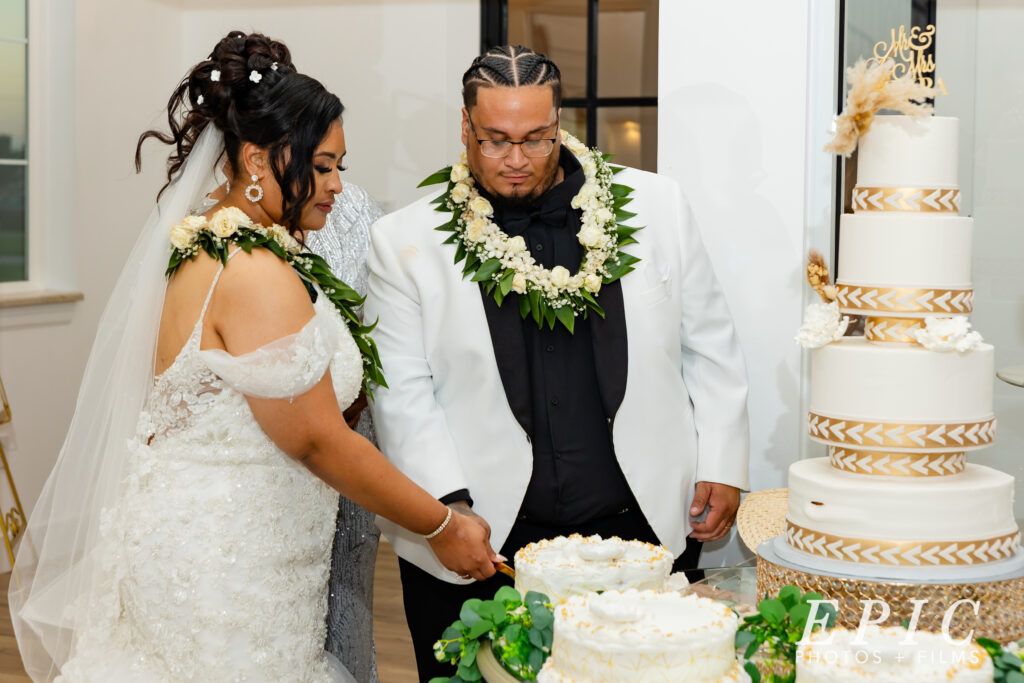 elegant cake cutting for the bride and groom on their wedding day near fort worth texas
