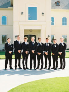 groomsmen on wedding day at chateau joli venue, wedding venue near dallas texas, wedding party responsibilities.